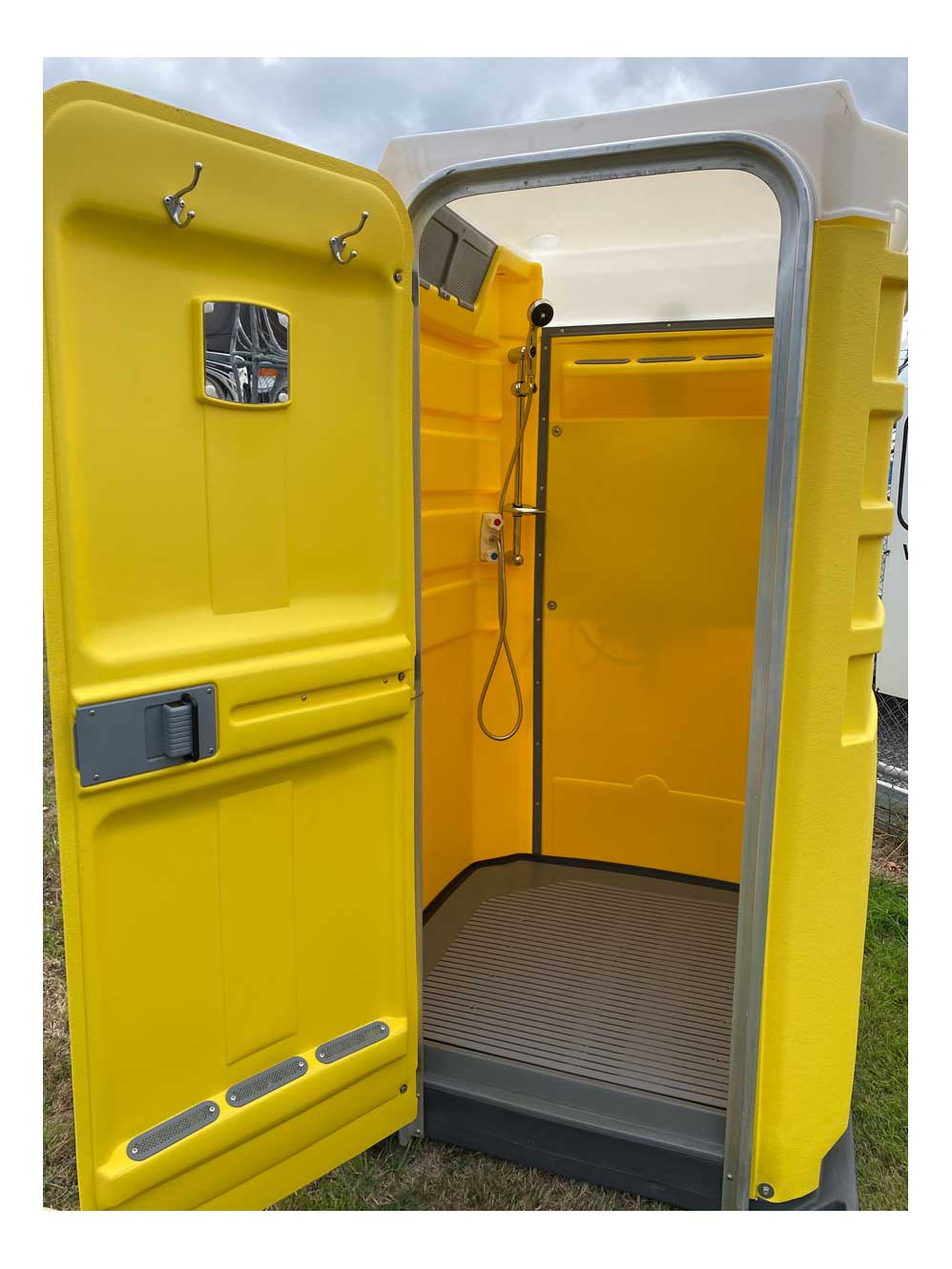 Yellow portable shower with the door open